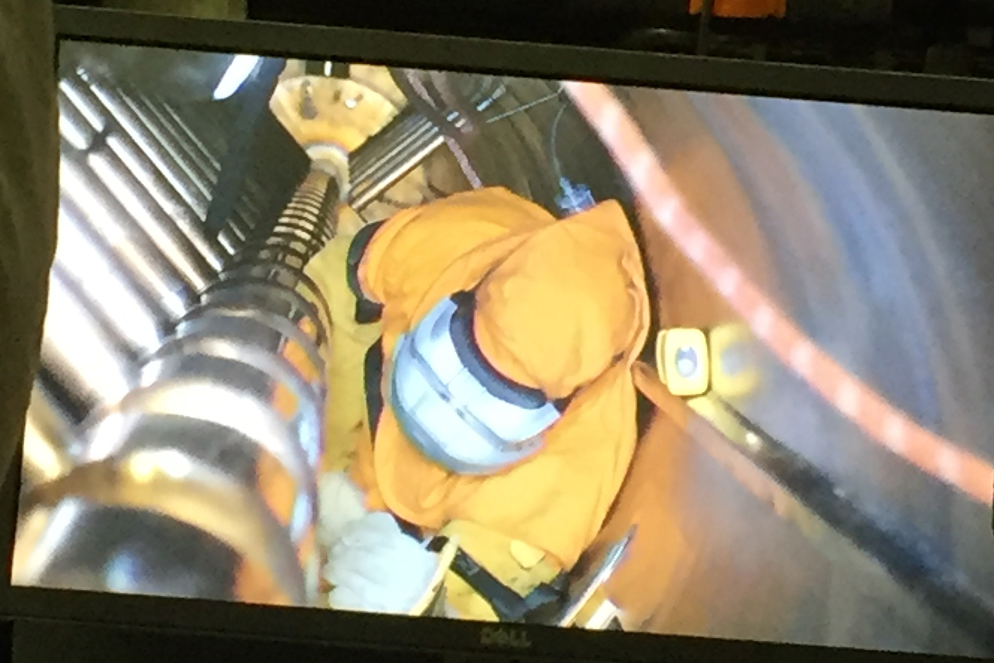 person replacing drift tube linac tank 
