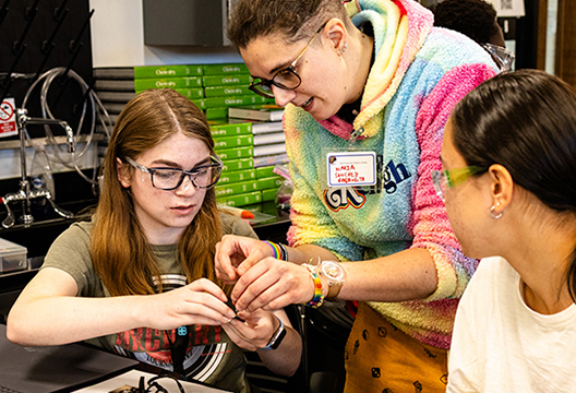 Maria Sanchez Barrueta leads a session about soldering with Josie Rielage and Hina Nanamura