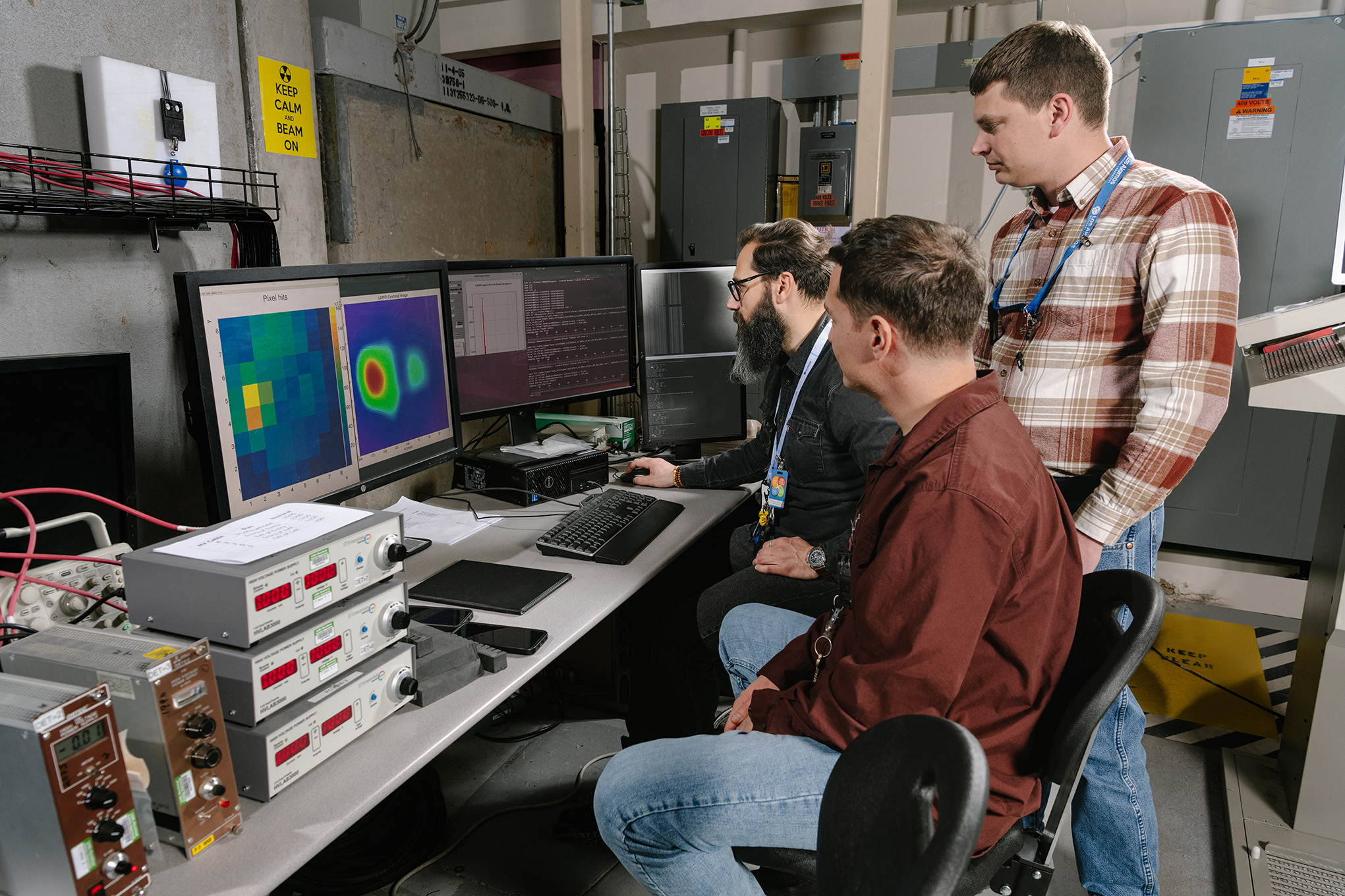 Members of the DICER team review results at the control desk.