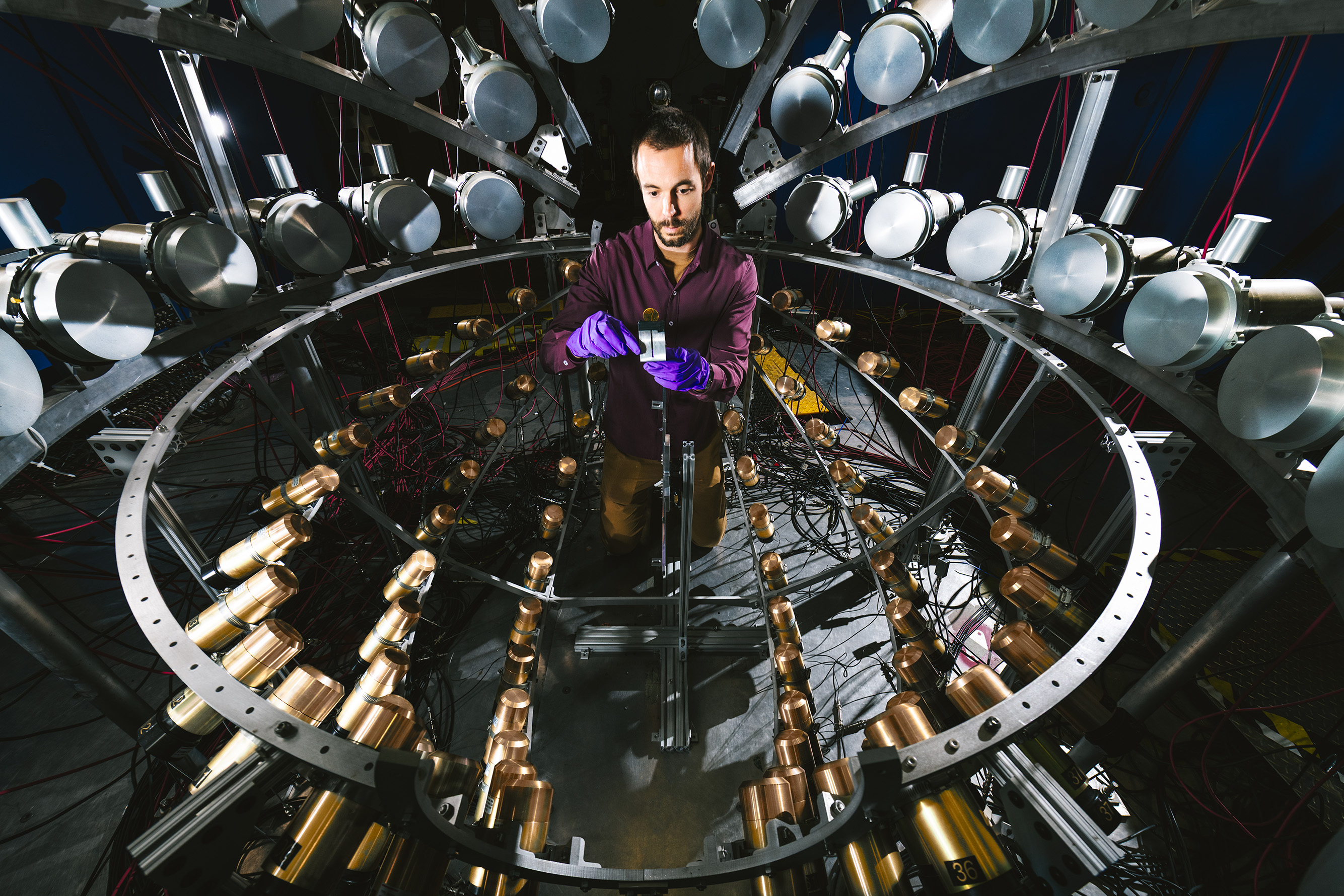 A scientist adjusting the target inside CoGNAC.