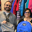 man and lady holding backpacks