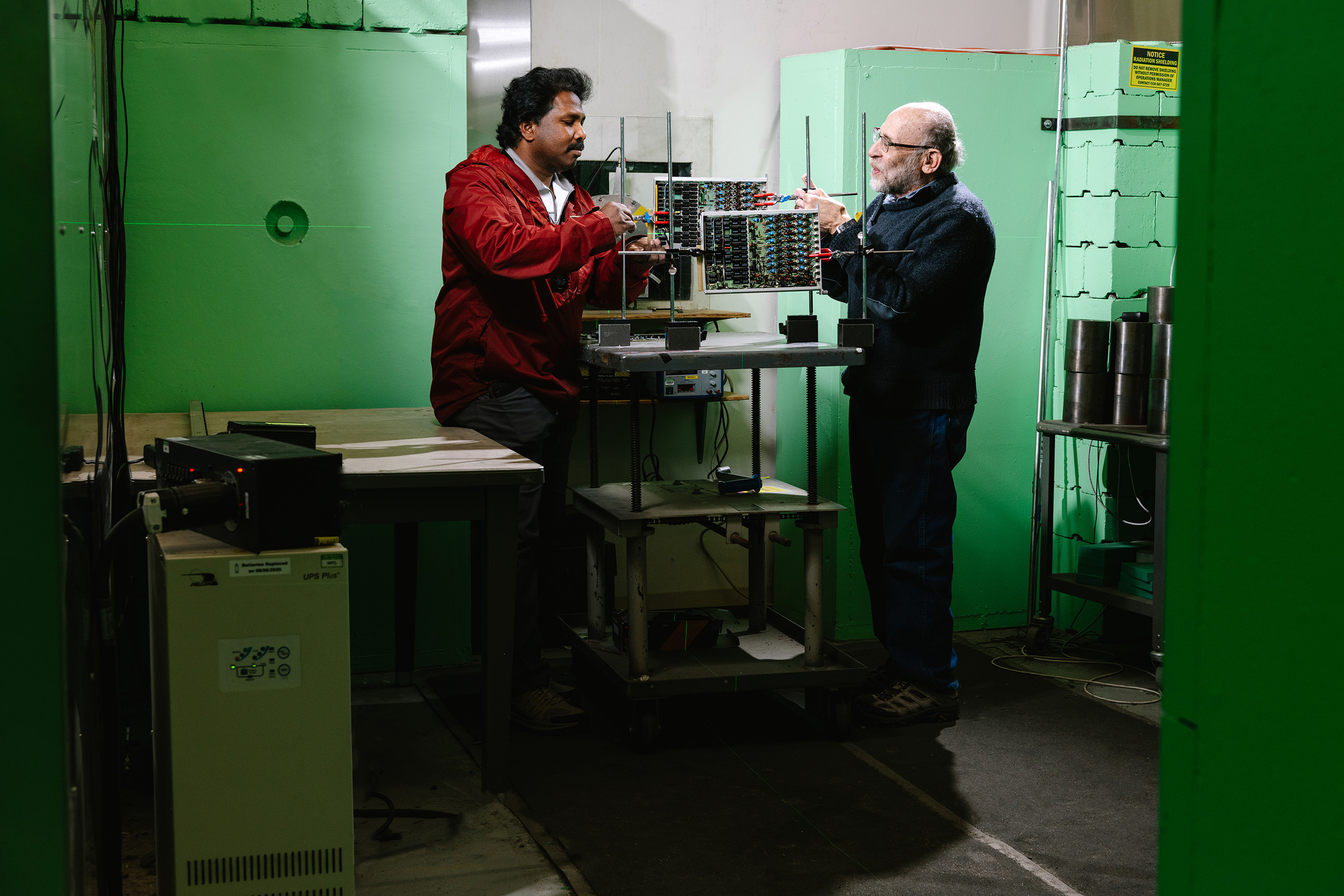 Steve Wender and Kranti Gunthoti positioning semiconductors in the beam bath.