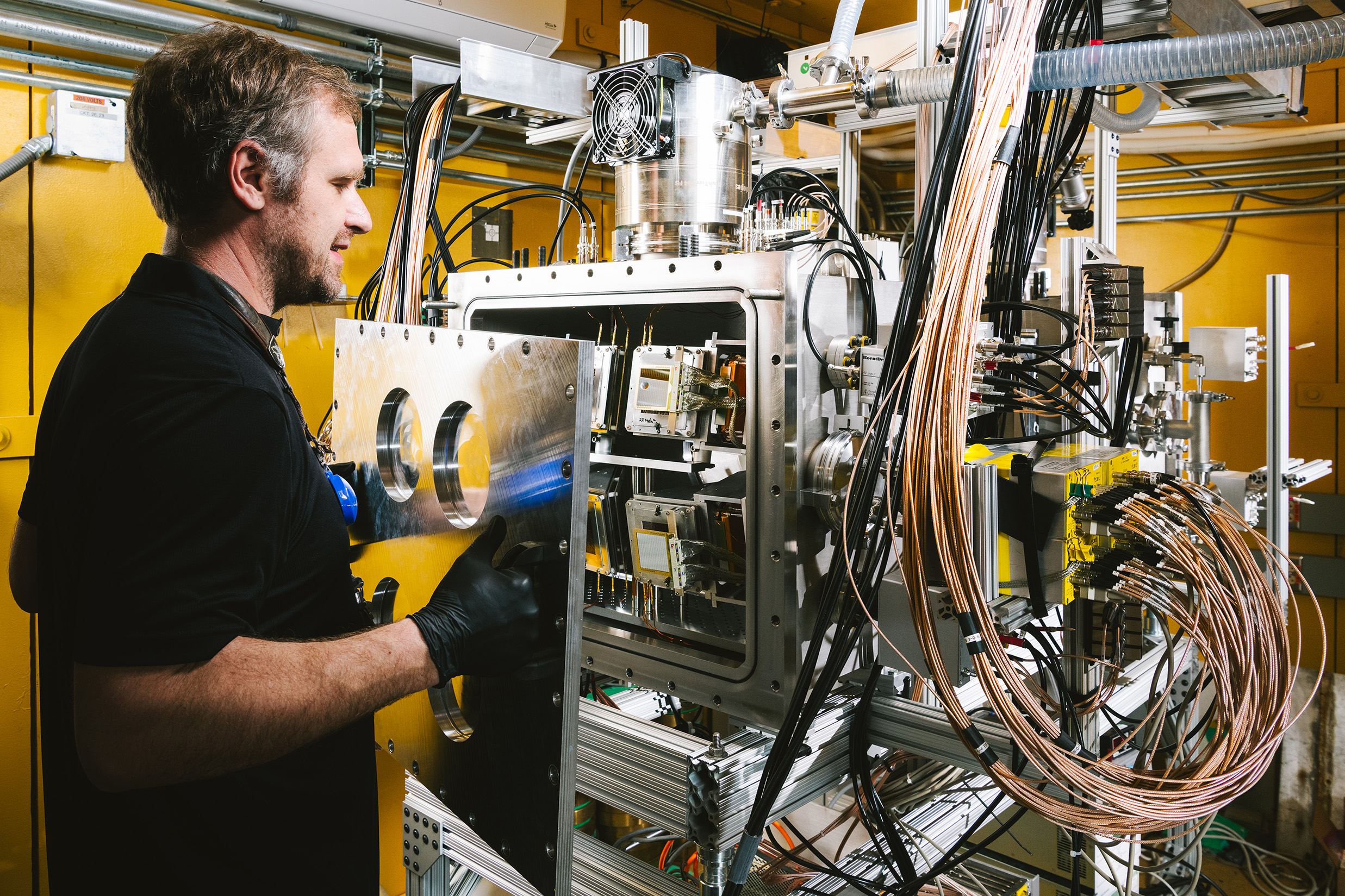 Jack Winkelbauer (Instrument Scientist) removes a panel from SPIDER.