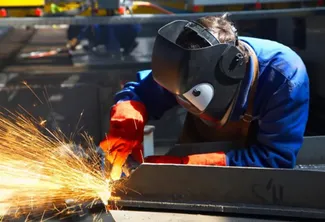 person welding at the Lab