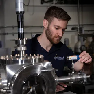 A Los Alamos National Laboratory scientist using scientific equipment.