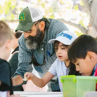 Aaron shows the class how to be good stewards of the river